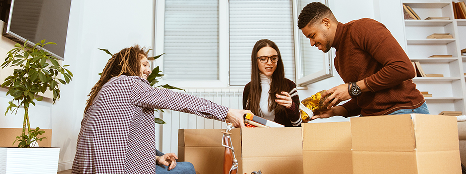 Students unpacking in their apartment.