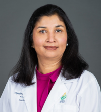 Physician scientist headshot in her white coat